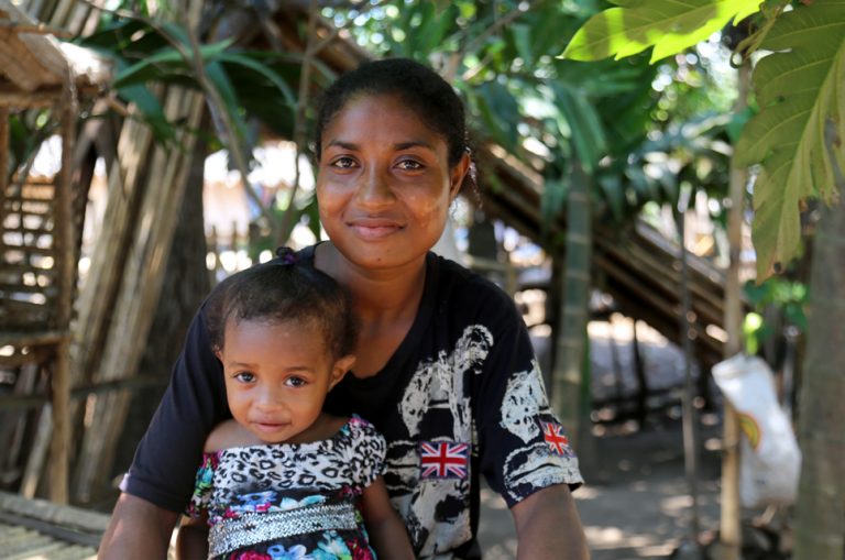 Village Health Volunteer Patricia (right) helped Judy (left) get treatment when she had complications during the birth of her daughter Joylyn in Papua New Guinea.